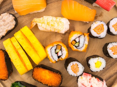 Top view of Sushi set on wooden plate, Japanese food.