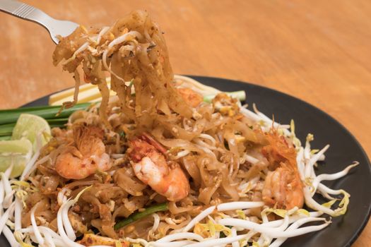Close up plate of Padthai, Thai noodle with fried shrimp and vegetable,Thai Food, Thailand's national dishes.