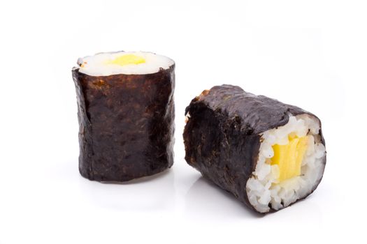 Sushi rolls of rice with egg and seaweed on white background, japanese food.
