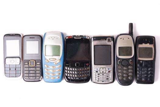 old and obsolete cellphone on a white background.