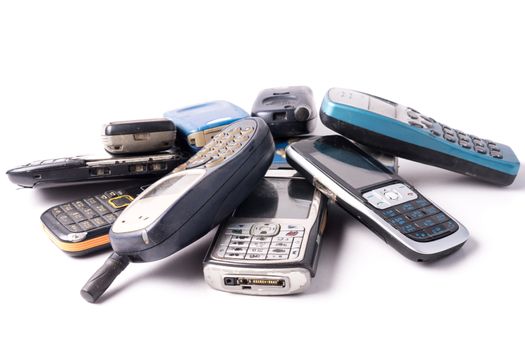 old and obsolete cellphone on a white background.