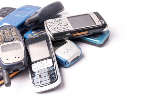 old and obsolete cellphone on a white background. Free space for text