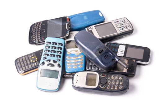 old and obsolete cellphone on a white background.