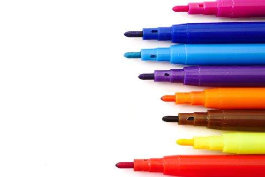 Magic colorful pens on a white background. Free space for text