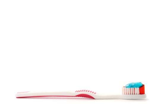 Toothbrush with toothpaste on a white background. Free space for text