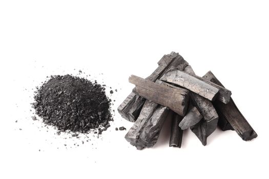 Charcoal and powder (activated carbon) on white background.