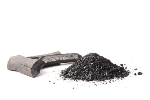 Charcoal and powder (activated carbon) on white background.