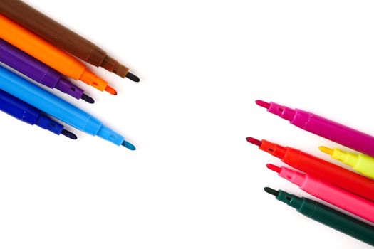 Magic colorful pens on a white background. Free space for text