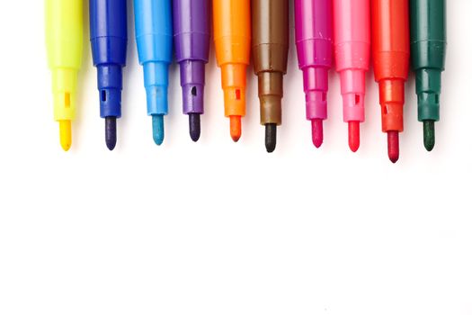 Magic colorful pens on a white background. Free space for text