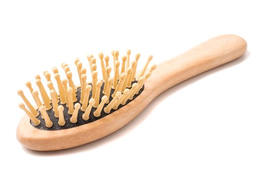 Wooden comb on a white background.