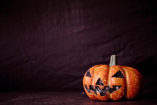 Halloween pumpkin on a black background. Vintage tone. Free space for text