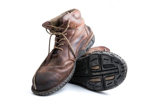 Men's brown leather shoes on white background.