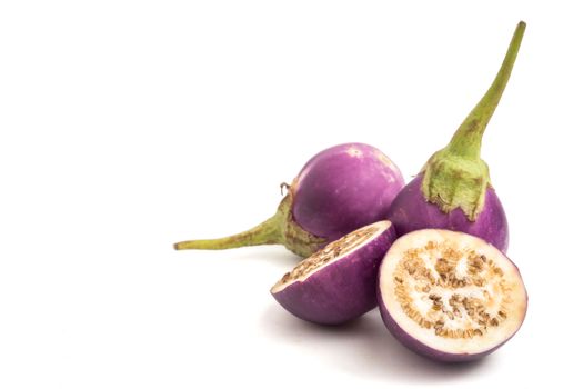 Fresh Purple eggplants on white background. Free space for text