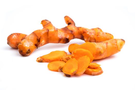 Turmeric roots on white background.