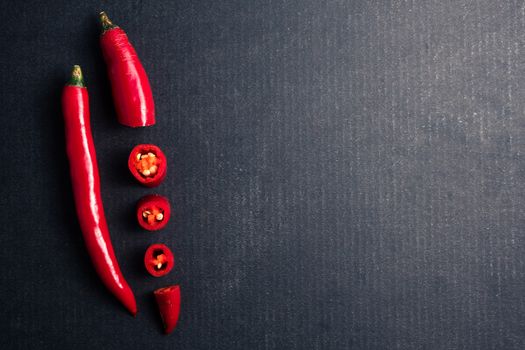 Fresh Red chili papper on black background. Free space for text