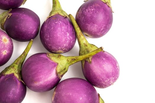 Fresh Purple eggplants on white background.