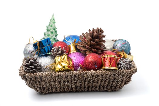 Christmas decoration in basket on white background.