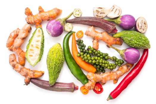 Group of fresh vegetables and herbs on white background.