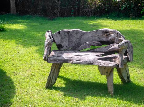 Old wooden table set  in the green garden.