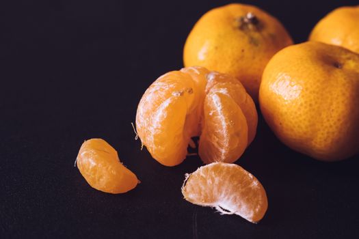 Close up of Fresh tangerines, Orange fruits on dark background.