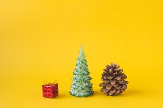 Christmas decorations on yellow background.