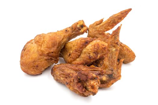 Fried chicken legs and wings on a white background.
