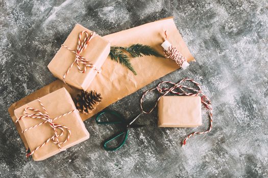 Preparation christmas gifts on gray grunge background.