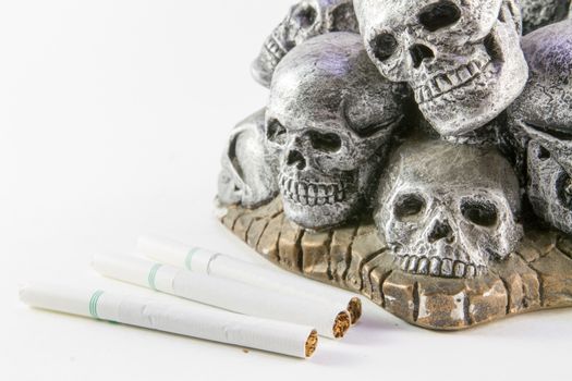 Anti smoking concept with cigarettes and skull