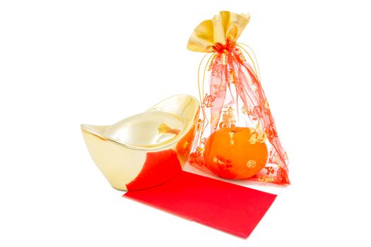 concept image of the chinese new year - Gold Ingot ,red packet and mandarin orange in the red auspicious bag