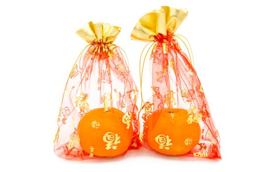 concept image of the chinese new year -mandarin orange in the red auspicious bag