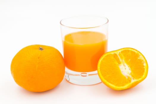 Orange juice and slices of orange on white background