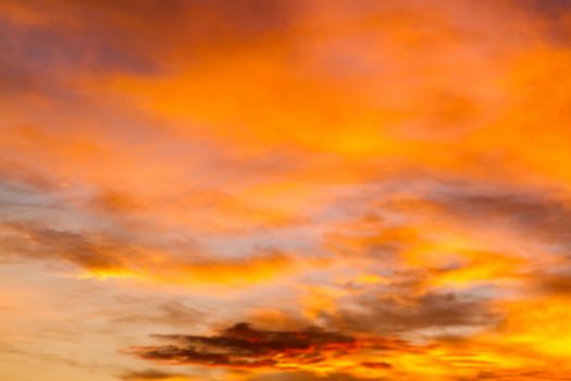 Dramatic sunrise sky with clouds.Blur or Defocus image.