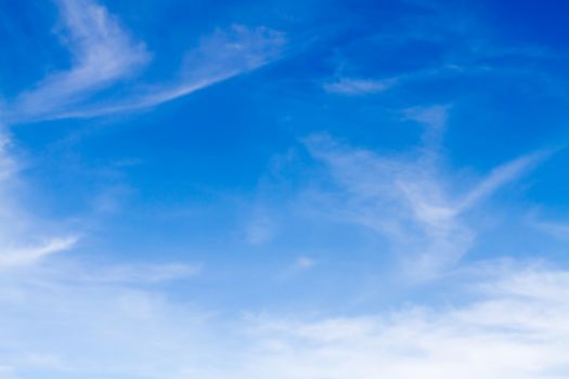 Blue sky background with white clouds.Blur or Defocus image.