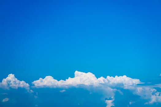 Beautiful heap clouds with clear blue sky and sun background