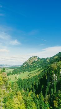 Beautiful nature of European Alps, landscape view of alpine mountains, lake and village in spring season, travel and destination scenery