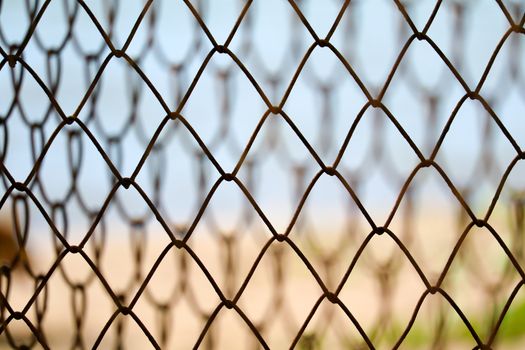 Steel wire fence to prevent dangerous areas along the beach and blur background