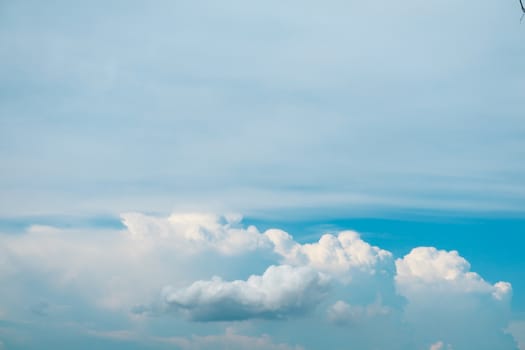 white heap cloud and tiny blue clear sky background