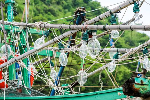 Spotlights was hanging on a fishing boat and squid fishing to catch the fish in the night