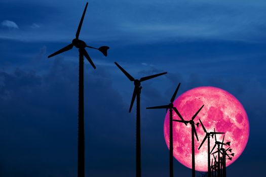 Old moon back Wind turbines produce wind energy which is a clean energy to replace coal and oil energy, Elements of this image furnished by NASA