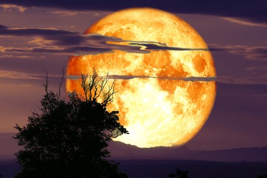 full crow moon back on silhouette cloud and mountain on night sky, Elements of this image furnished by NASA