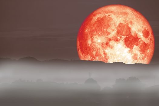 full red fish moon back on cloud and fog on mountain night sky, Elements of this image furnished by NASA