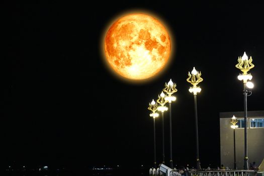 full blood moon on night sky and Naga light pole, Elements of this image furnished by NASA