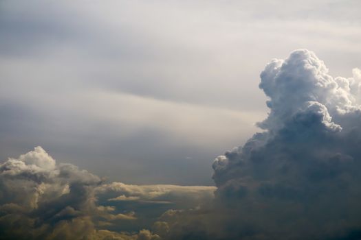 storm silhouette heap cloud sun ray in gray skyscape dark cloud background