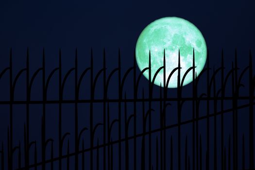 full egg moon back on silhouette Iron fence on night sky, Elements of this image furnished by NASA