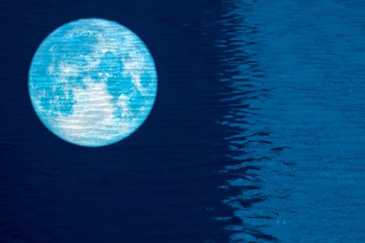 reflection full fish moon on water surface of swimming pool, Elements of this image furnished by NASA