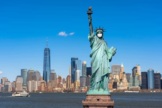 The Statue of Liberty wearing surgical mask when Covid-19 Outbreak over the Scene of New york cityscape river side, united state, coronavirus pandemic, Architecture and building with tourist concept