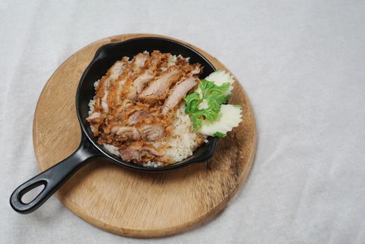 Rice steamed with soup and crispy fried chicken topping.