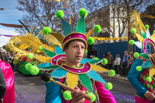 Loule, Portugal - February 25, 2020: percussionists parading in the street accompanying dancers in the parade of the traditional carnival of Loule city on a February day