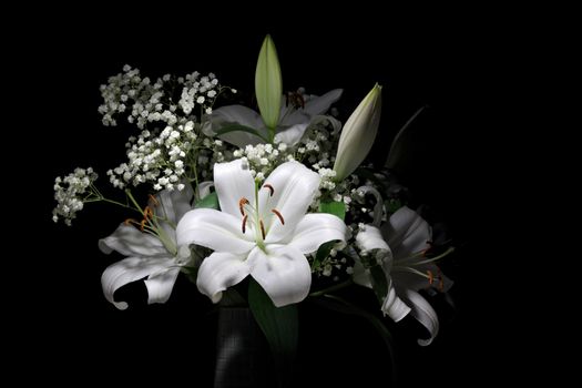 A large bouquet of bright white lilies and Gypsophila Paniculata