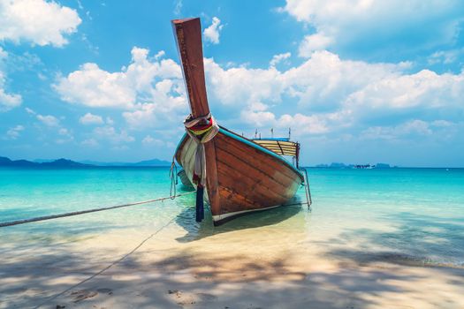 Thai long tail bot send beach blue sea water white wave seascape background